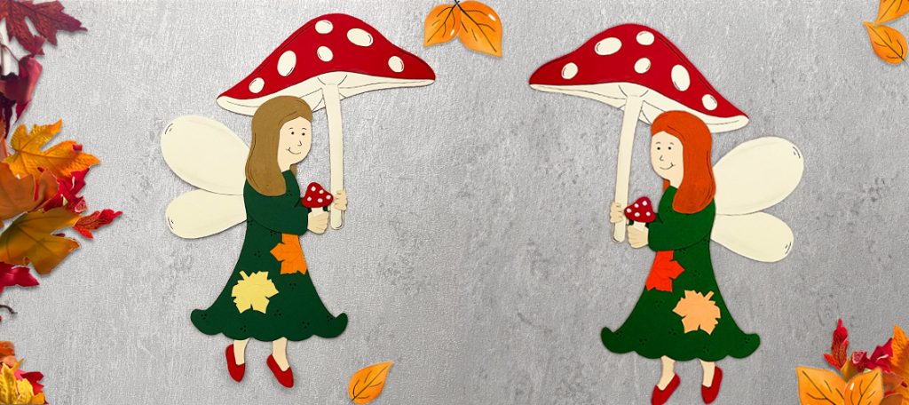 Gebastelte Waldfee aus Papier mit bunten Herbstblättern und Flügeln